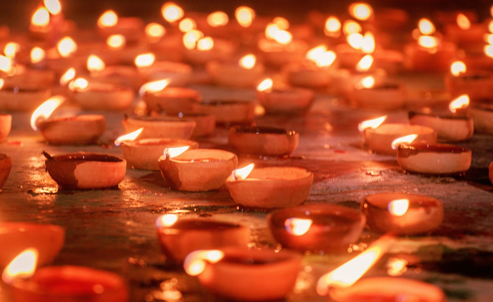 A warm display of diya lamps creating a festive atmosphere during Diwali, the Festival of Lights.