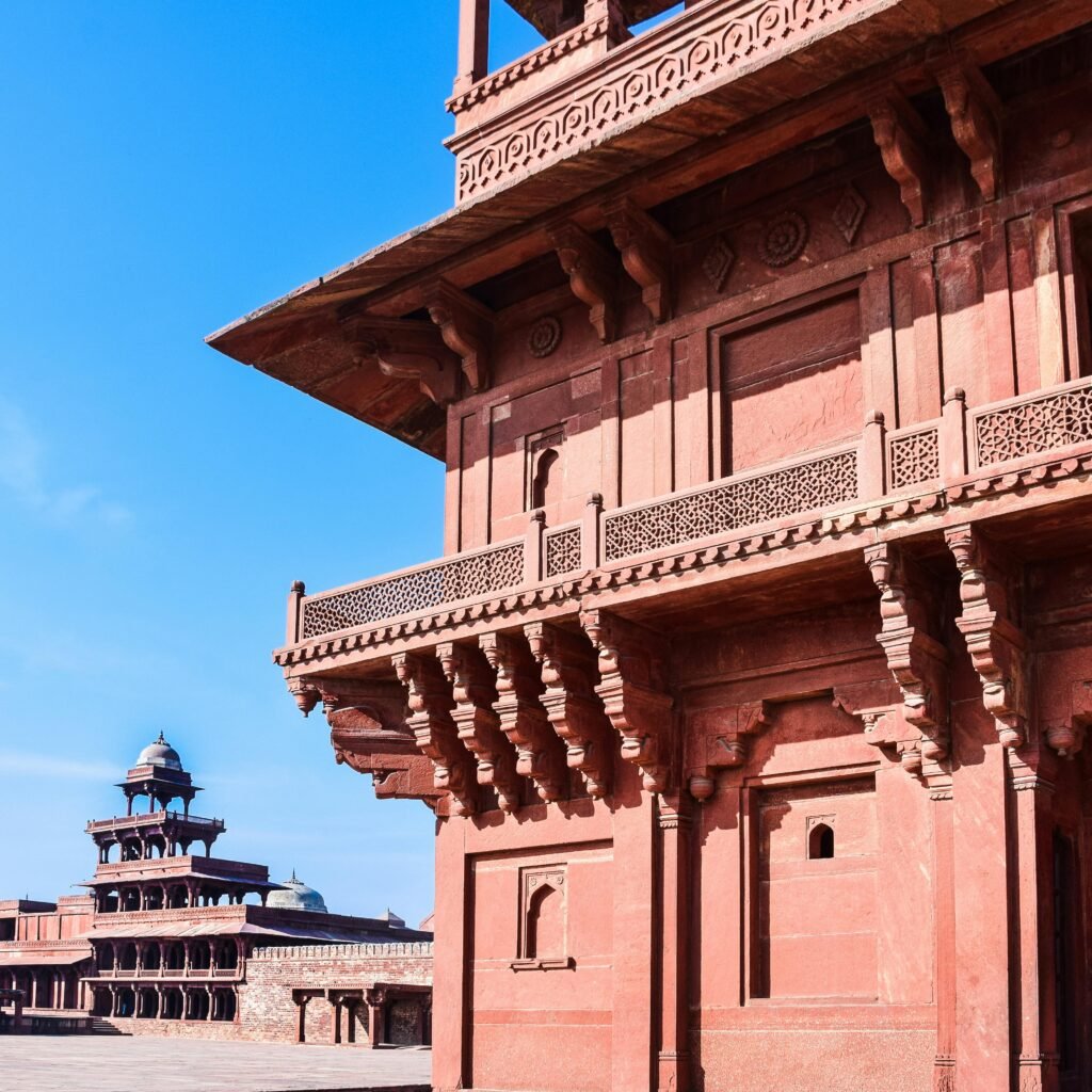 Sunlit view of the Diwan-I-Khas in Fatehpur Sikri, showcasing Mughal architecture.